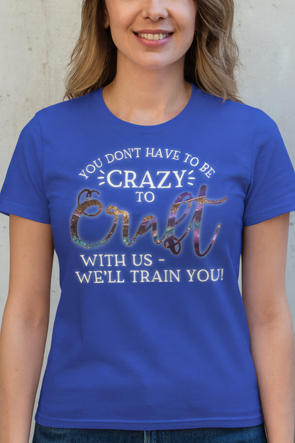 Person wearing a blue t-shirt with a humorous craft-themed message.